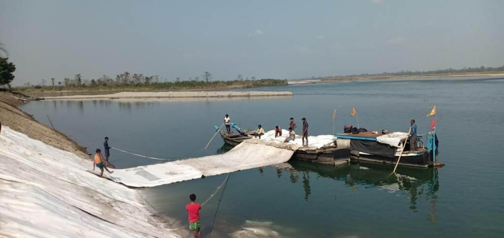 Duming of geobag in river